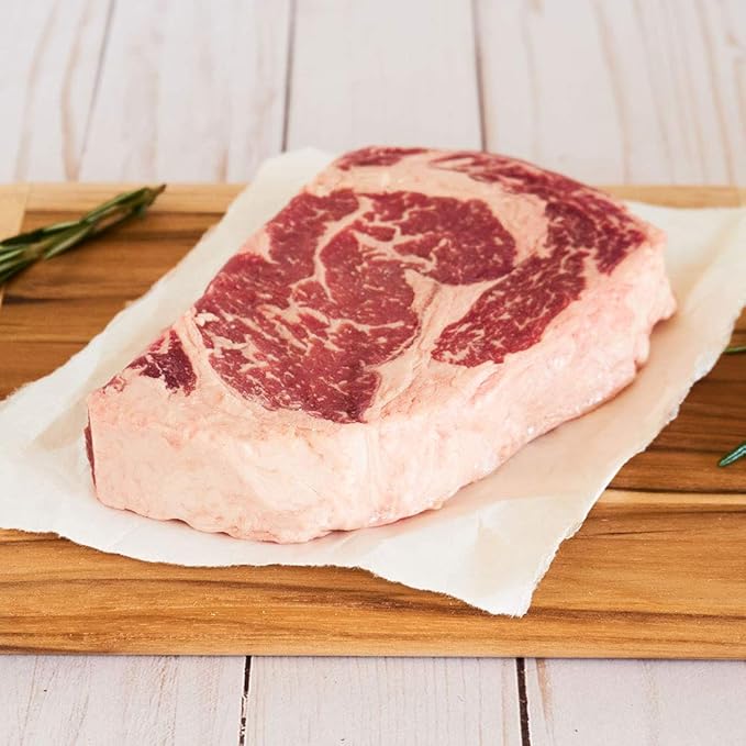Nebraska Star Beef Prestige Steaks - 12 Packs with Signature Seasoning (12-14oz Ribeyes)