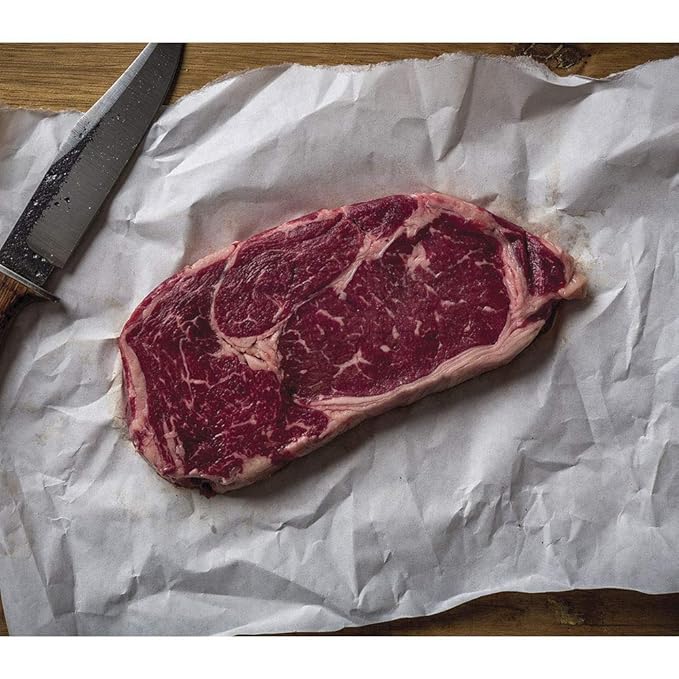 Aged Premium Angus Ribeye and NY Strip and Filet Mignon by Nebraska Star Beef - All Natural Hand