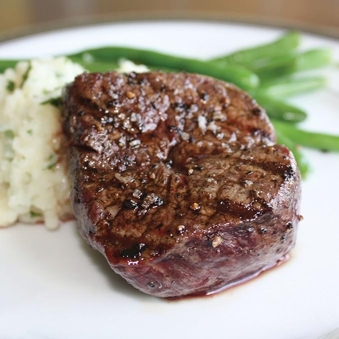 Aged Premium Angus Ribeye and NY Strip and Filet Mignon by Nebraska Star Beef - All Natural Hand