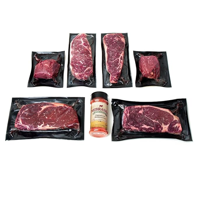Aged Premium Angus Ribeye and NY Strip and Filet Mignon by Nebraska Star Beef - All Natural Hand